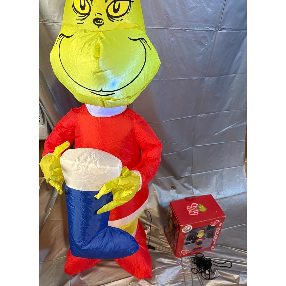 Gemmy Airblown Inflatable Grinch with a Blue Stocking
